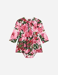 Interlock dress with rose print over a white background