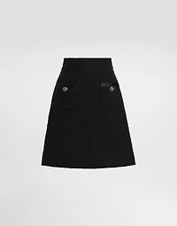 Short raschel tweed A-line skirt with bejeweled buttons