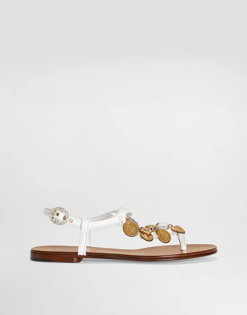 Raffia thong sandals with embroidered votive medallions