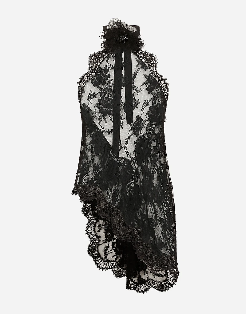 Asymmetrical lace top with flower detail on neck