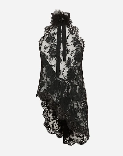 Asymmetrical lace top with flower detail on neck