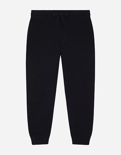 Plain knit jogging pants with logo tag