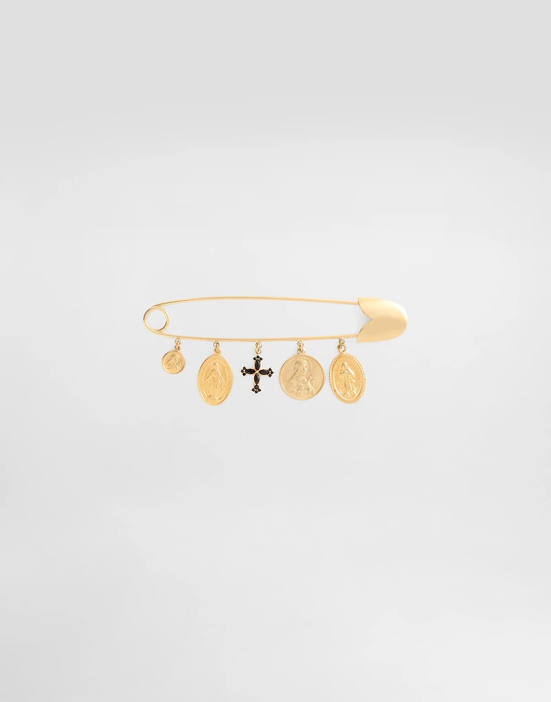 Safety brooch with cross and medals