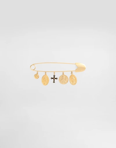Safety brooch with cross and medals