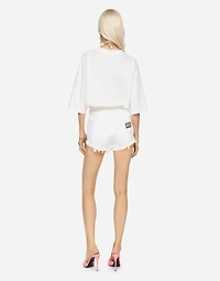 Denim shorts with ripped details and abrasions