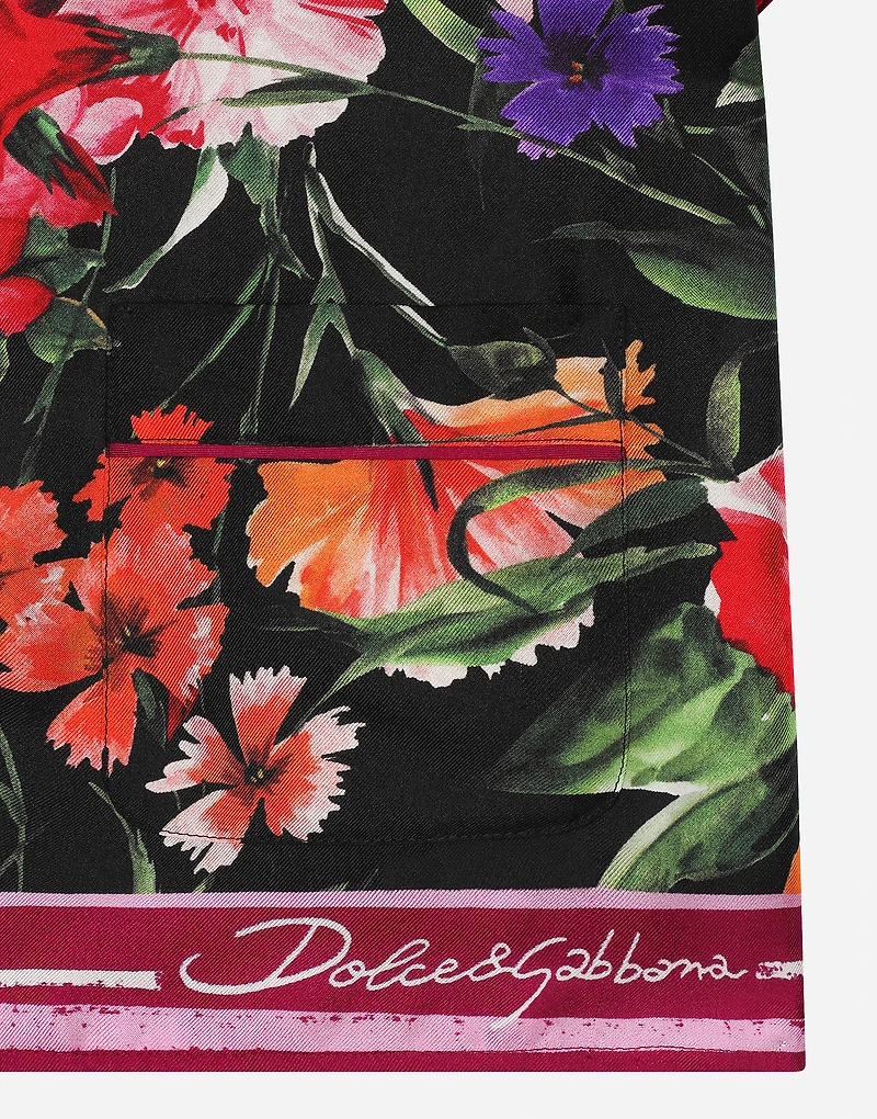 Twill shirt with floral print over a black background