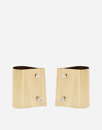 Rigid metal cuffs and rhinestone-detailed buttons