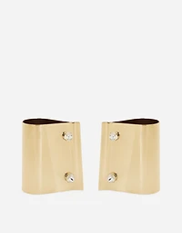 Rigid metal cuffs and rhinestone-detailed buttons