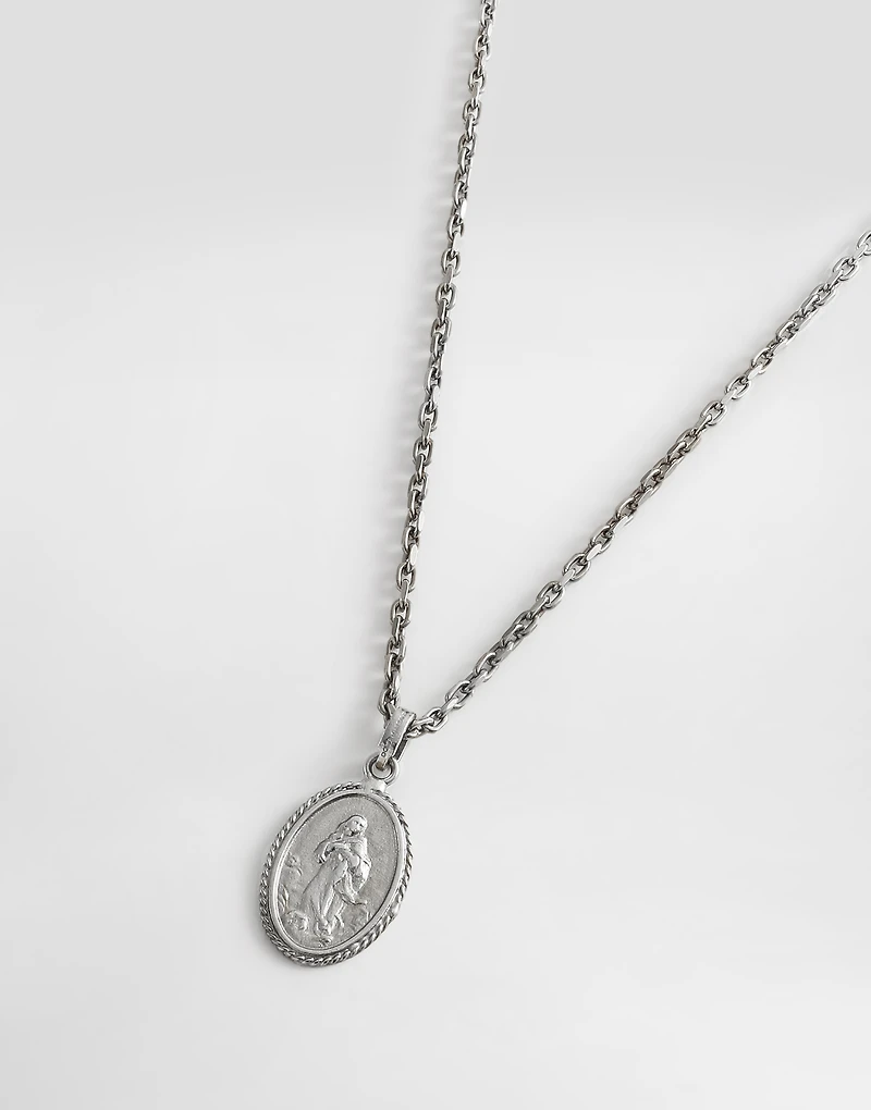 Metal necklace with engraved medallion