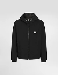 Leather and fabric jacket with reversible hood