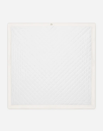 Quilted jacquard blanket with DG logo