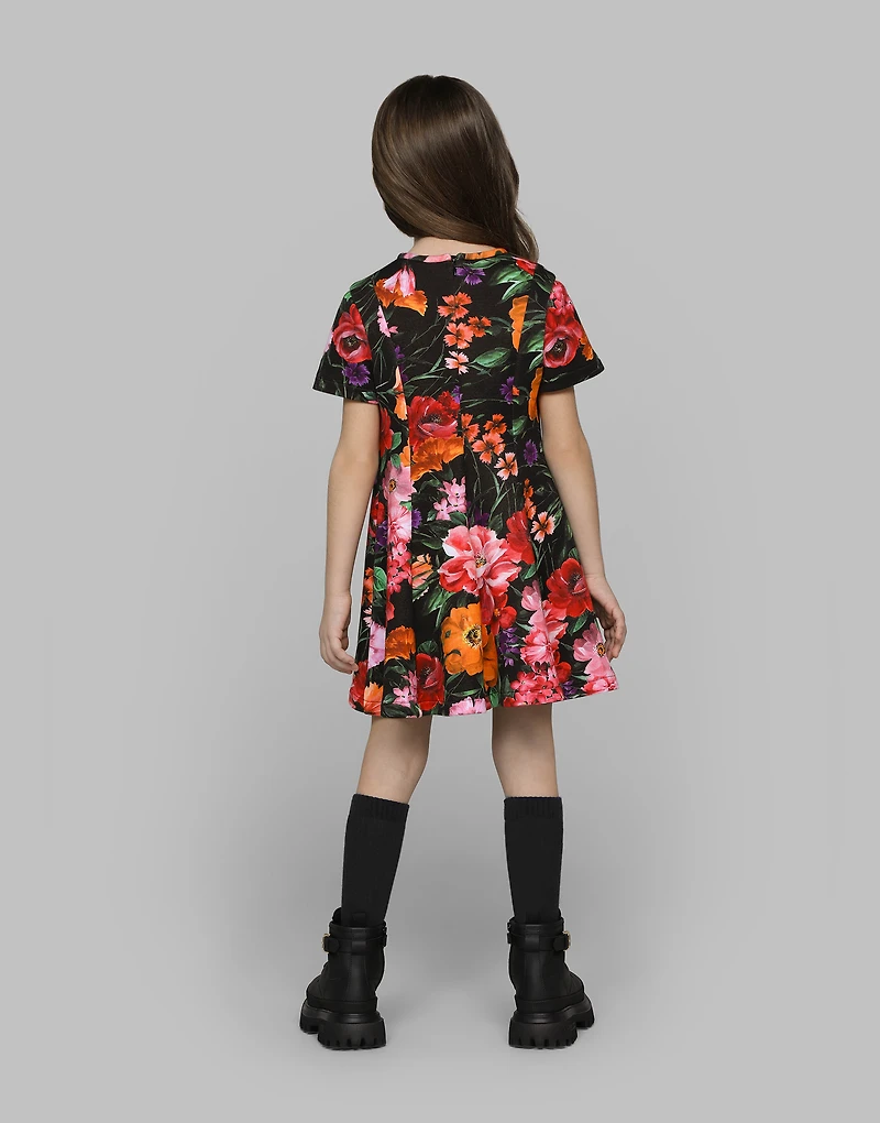 Neoprene dress with floral print over a black background