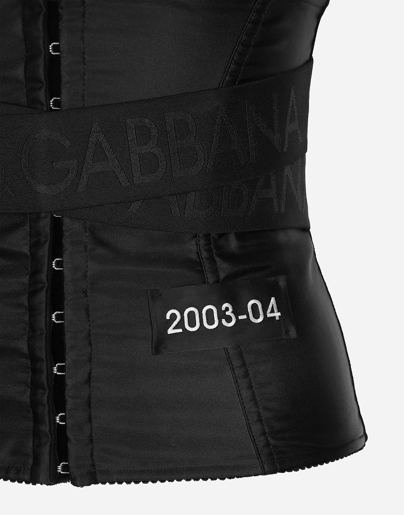 Corset-style belt with branded stretch crossover bands