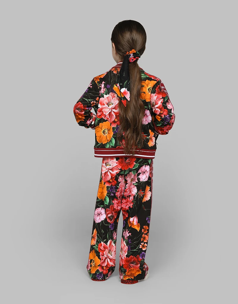 Jersey sweatshirt with floral print over a black background