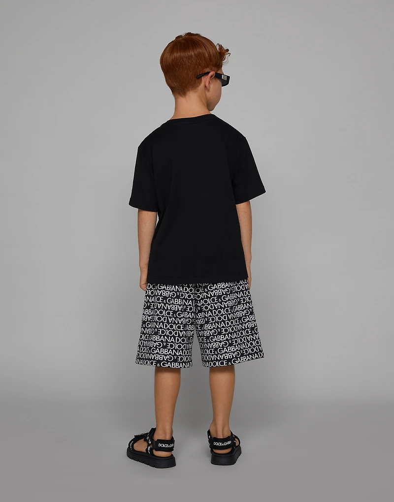 Cotton jogging shorts with the all-over logo print