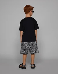 Cotton jogging shorts with the all-over logo print