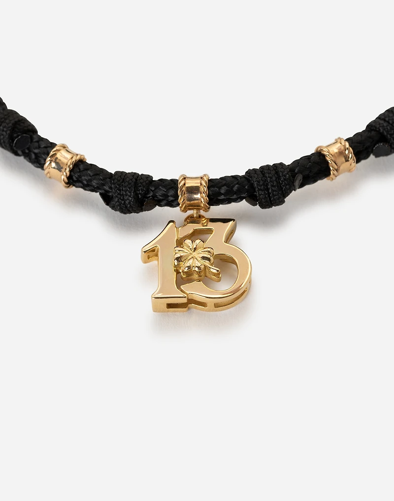  Good Luck Bracelet fabric with a pendant in 18 carat yellow gold