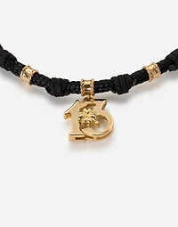  Good Luck Bracelet fabric with a pendant in 18 carat yellow gold
