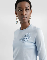 Silk pullover with flower brooch