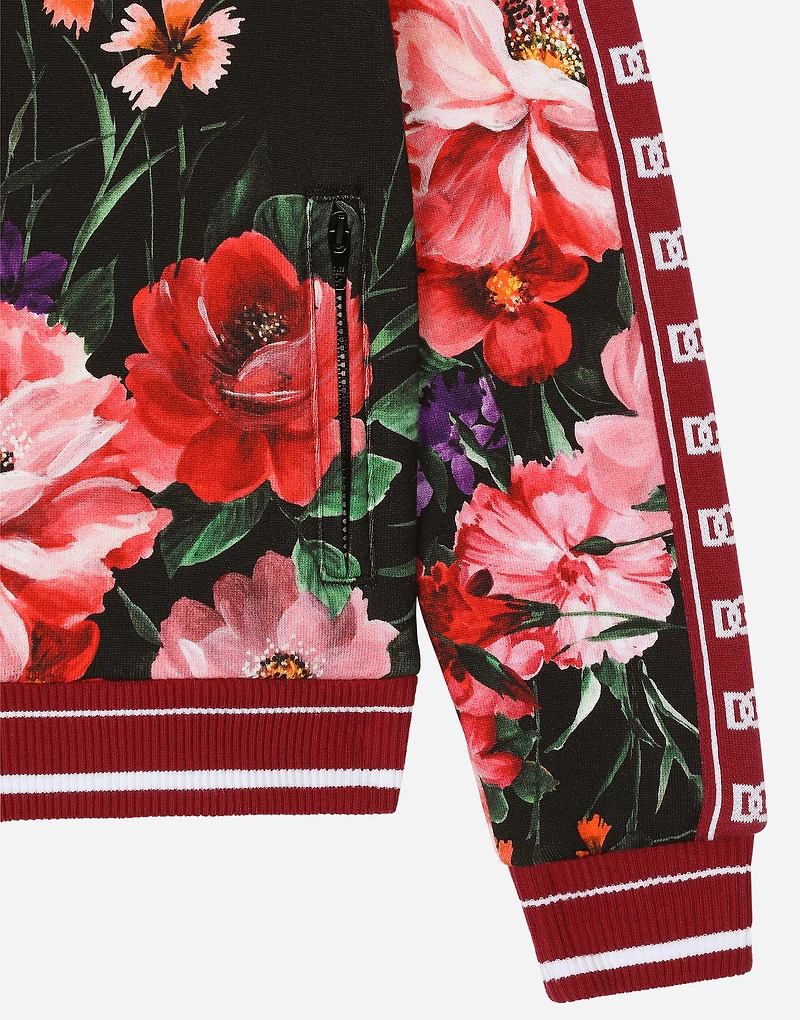 Jersey sweatshirt with floral print over a black background