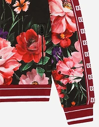 Jersey sweatshirt with floral print over a black background