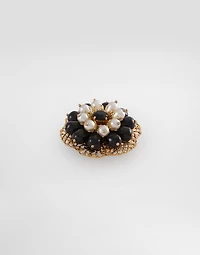 Metal brooch with rhinestones