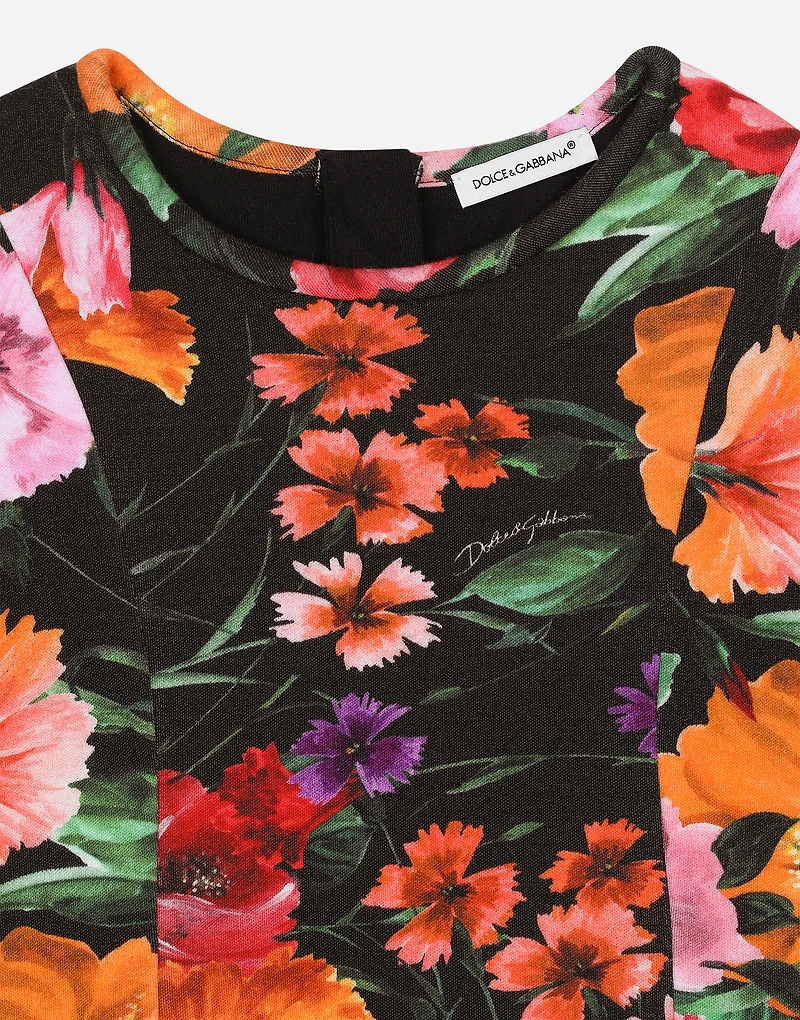 Neoprene dress with floral print over a black background