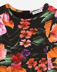 Neoprene dress with floral print over a black background