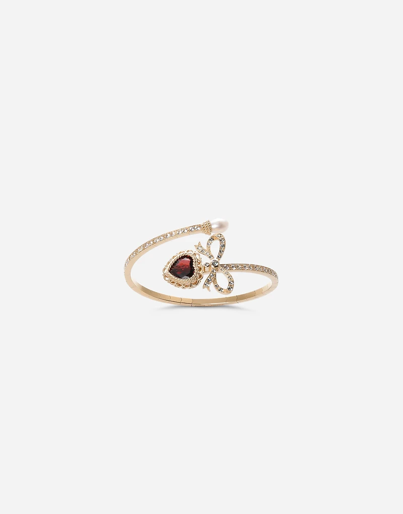 Devotion Bracelet
18 carat yellow gold, rhodolite garnet and sapphires