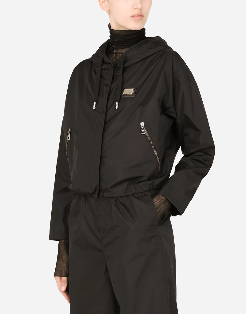 Technical fabric windbreaker with hood