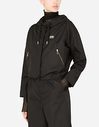 Technical fabric windbreaker with hood