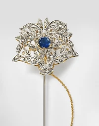 Sicily Brooch  18-carat yellow and white gold, blue sapphires, and diamonds