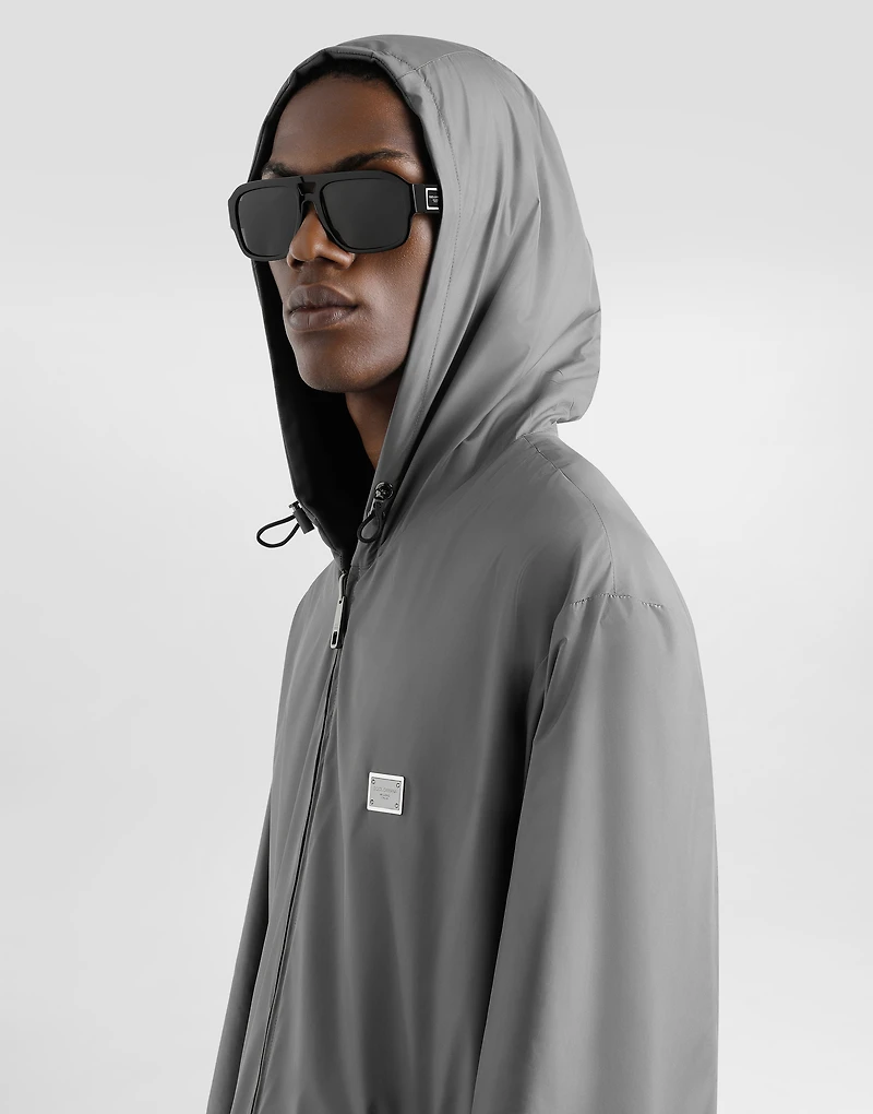 Technical fabric sports jacket with hood