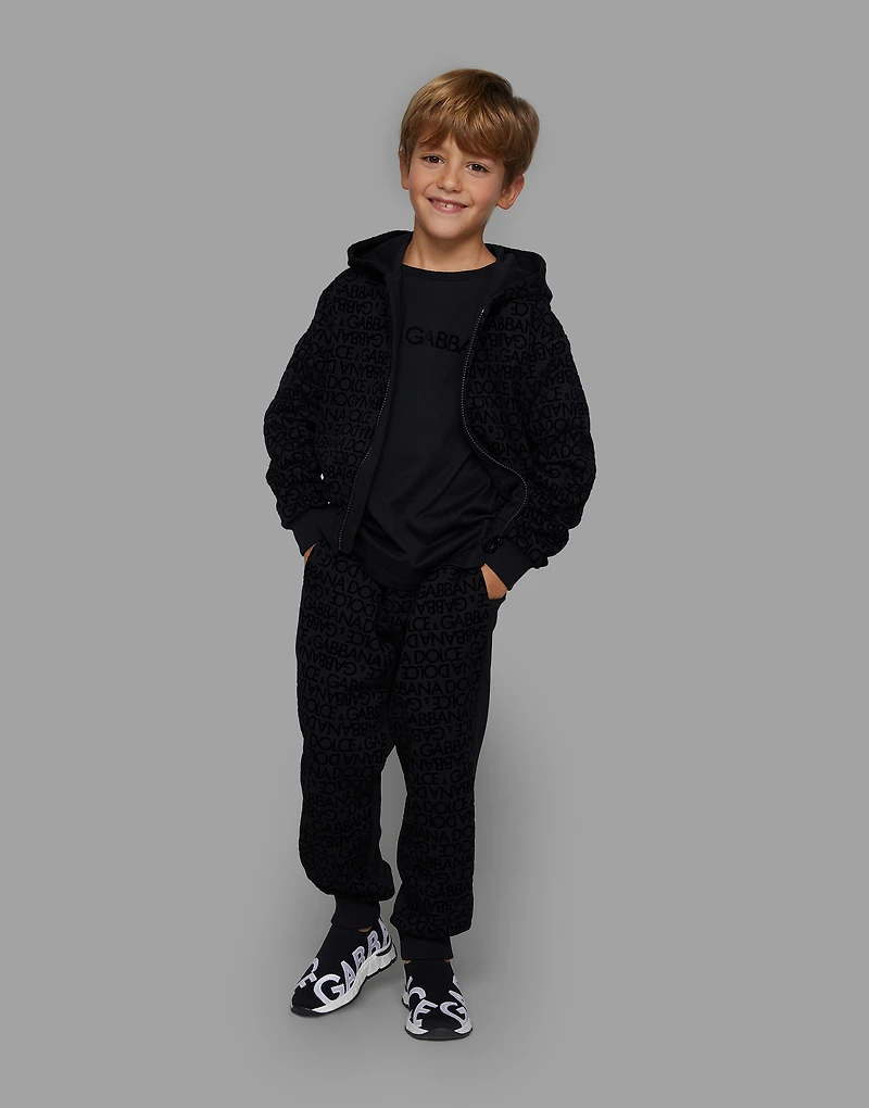Jersey jogging pants with all-over flocked print