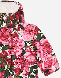 Short nylon down jacket with rose print over a white background