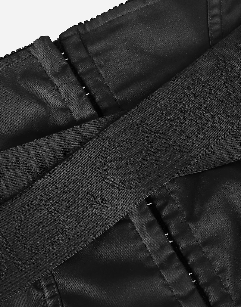 Corset-style belt with branded stretch crossover bands