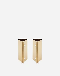 Rigid metal cuffs and rhinestone-detailed buttons