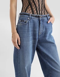 Loose denim jeans with pressed pleat