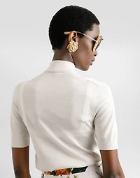 Silk pullover with flower brooch