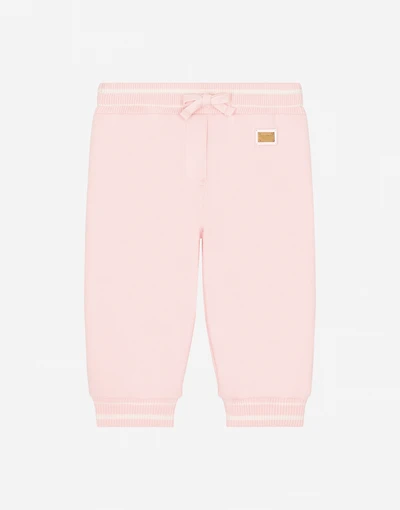 Jersey pants with branded tag