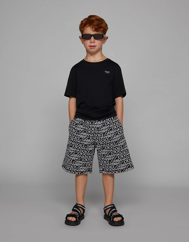 Cotton jogging shorts with the all-over logo print
