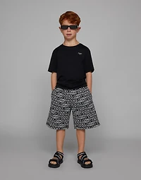 Cotton jogging shorts with the all-over logo print