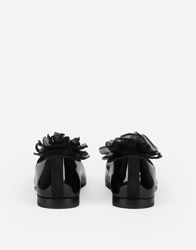 Patent leather slippers with flower appliqué