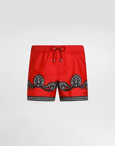 Short swim trunks with bandanna print