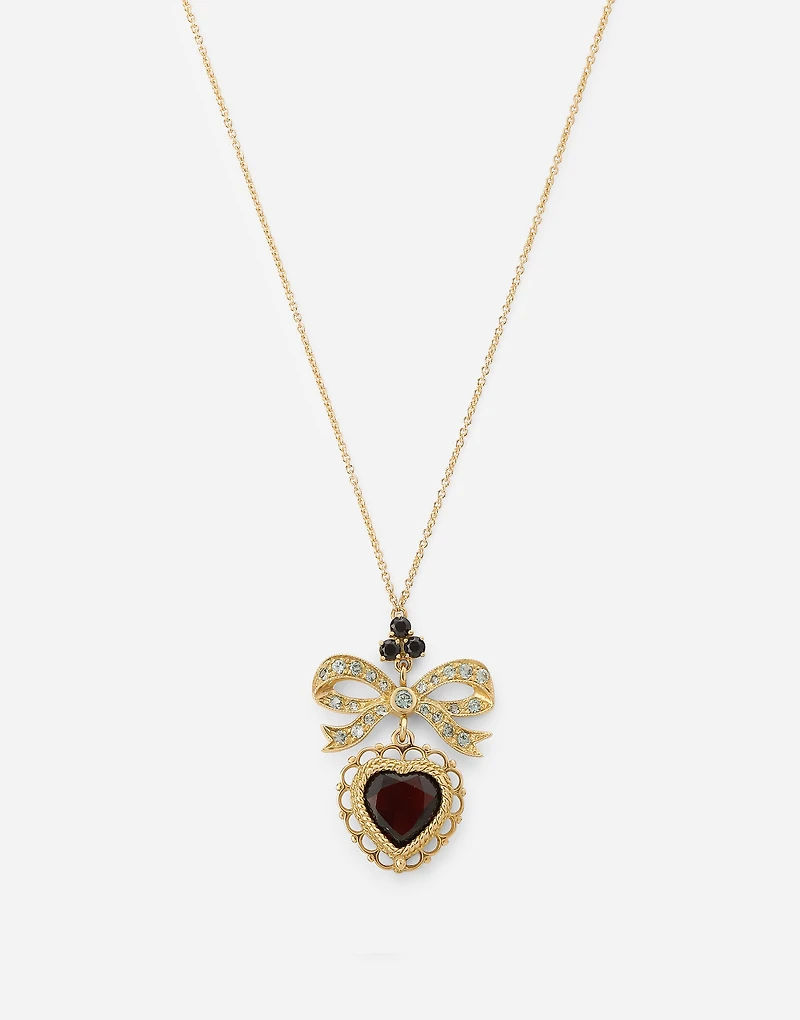 Devotion Pendant
 18 carat yellow gold, red garnet and gray sapphires
