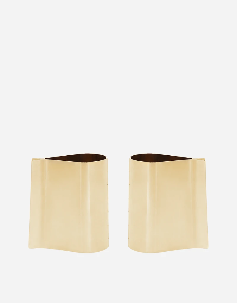 Rigid metal cuffs and rhinestone-detailed buttons