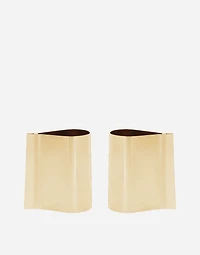 Rigid metal cuffs and rhinestone-detailed buttons