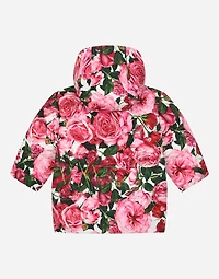 Short nylon down jacket with rose print over a white background