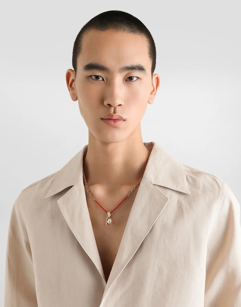 Metal necklace with gemstones and charms