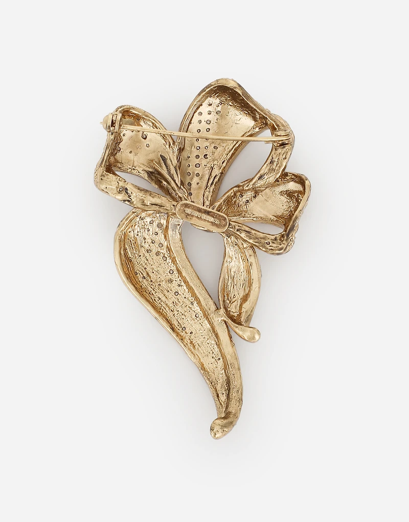 Braided ribbon-style brooch with bow